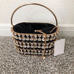 Oval Rhine Stones drawstring Party Clutch.